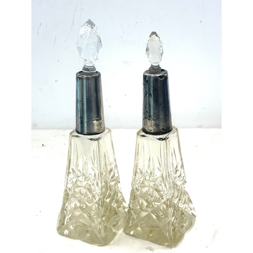 544 - Pair Edwardian Silver collar scent bottles, non matching stoppers, damage to neck inset as seen in i... 