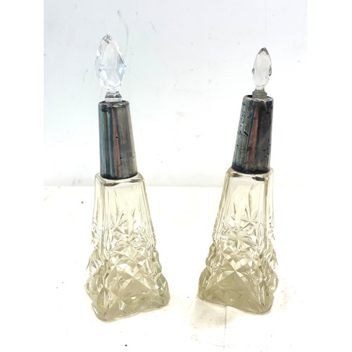 544 - Pair Edwardian Silver collar scent bottles, non matching stoppers, damage to neck inset as seen in i... 