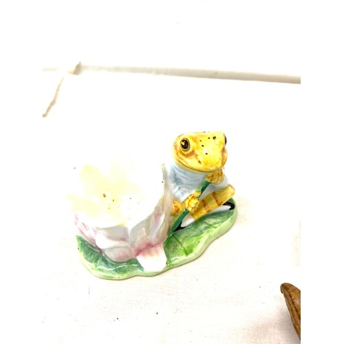 153 - Two Beatrix potter egg cups and egg cosies