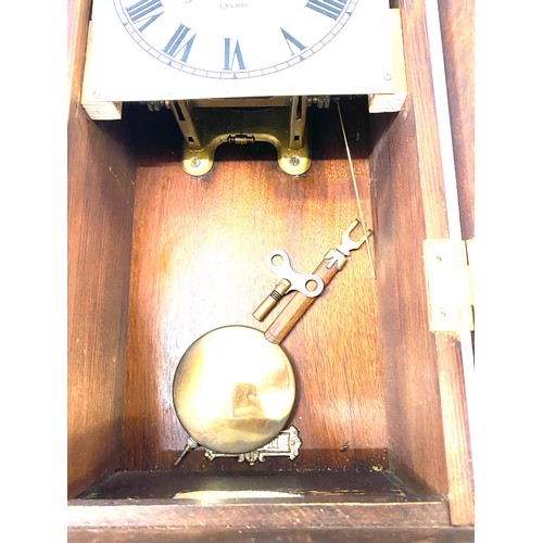 123 - 2 Key hole oak cased wall clock with key pendulum etc