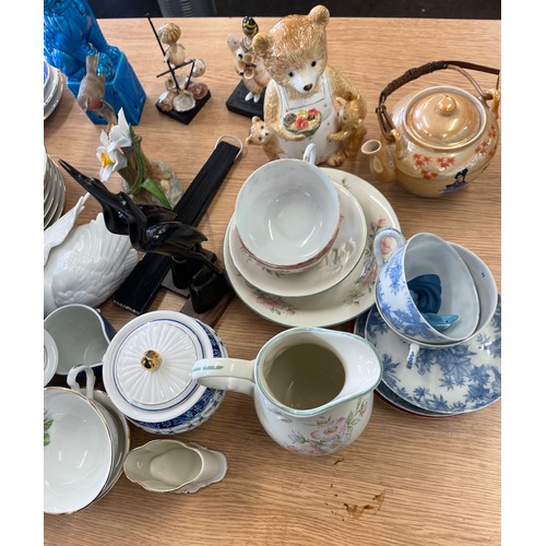 222 - Large selection of miscellaneous items includes russian dolls, gravy boat etc