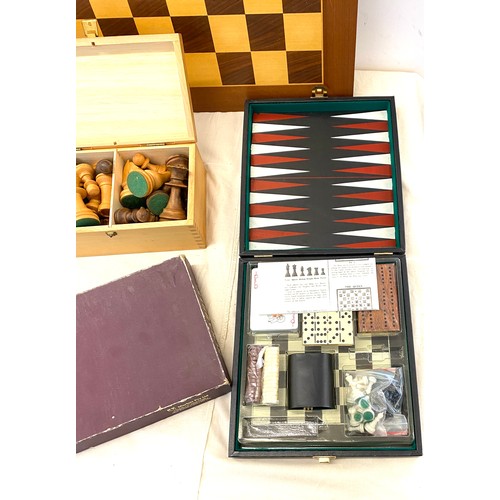 218 - Selection of games includes chess board and pieces, scrabble and a traveling game set