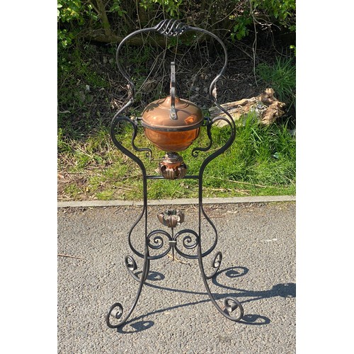 248 - Antique copper spirit kettle on wrought iron stand