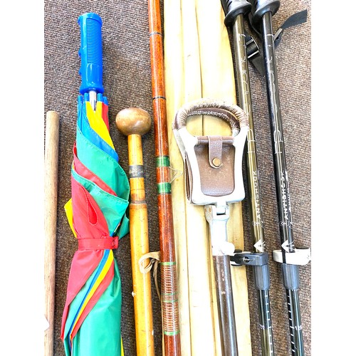 225 - Large selection of walking stick, shooting sticks, umbrellas etc