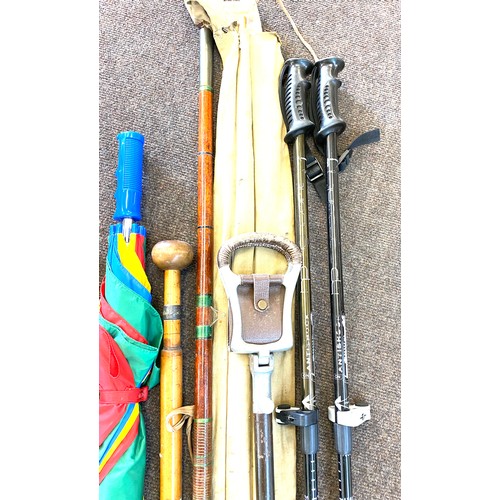 225 - Large selection of walking stick, shooting sticks, umbrellas etc