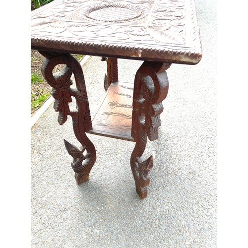 435 - Carved top and bottom occasional table measures approx 326