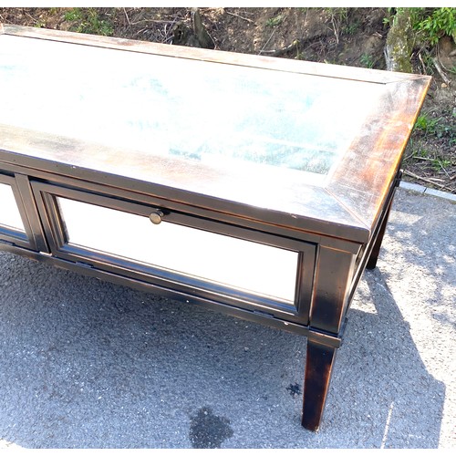 444 - Wooden and glass display coffee table measures approx 18