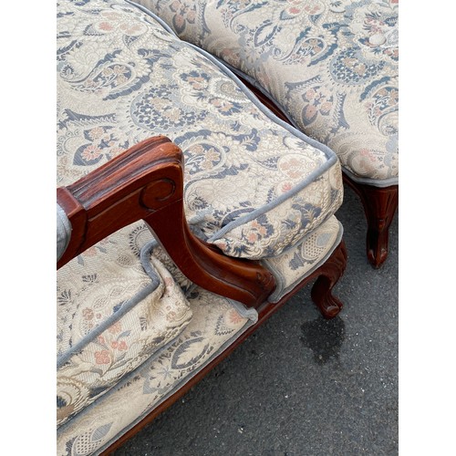 434 - Upholstered armchair with matching footstool, made by Wade