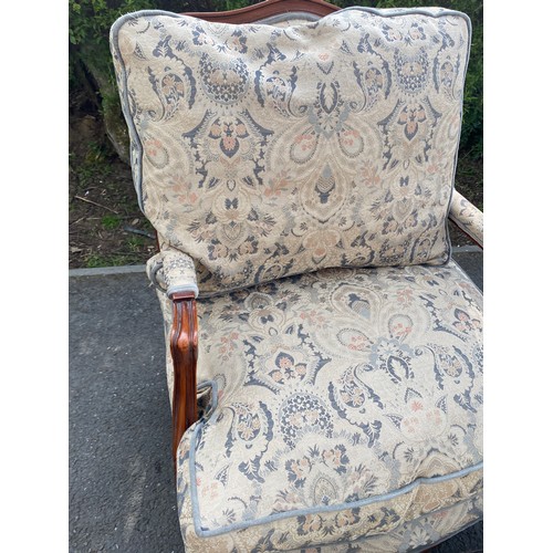 434 - Upholstered armchair with matching footstool, made by Wade