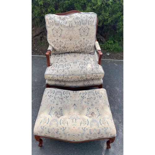 434 - Upholstered armchair with matching footstool, made by Wade