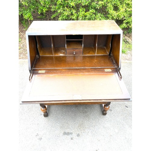 428 - 2 Drawer oak bureau measures approx 40