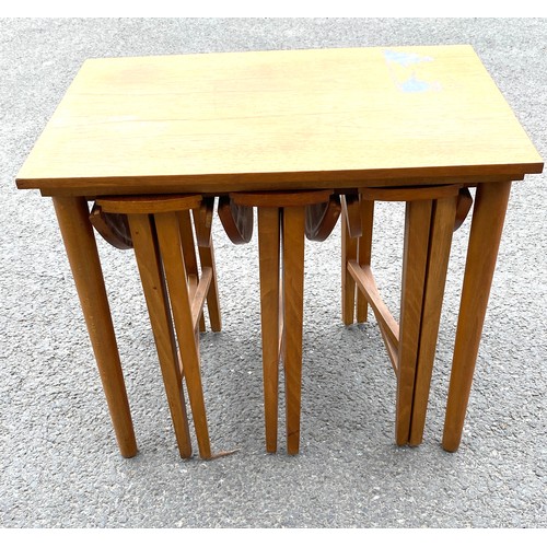 427 - Vintage nest of 4 tables, with damage to the top measures approx 21