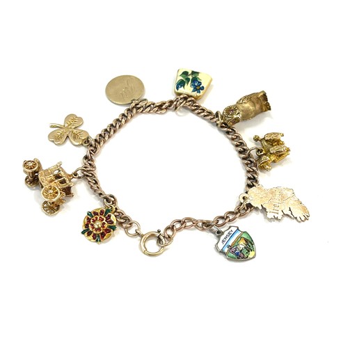 580 - Vintage 9ct gold charm bracelet and charms total weight approx 32g,