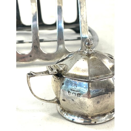 569 - 3 pieces of silver to include toast rack, pepper pot and mustard pot, overall total silver weight ap... 