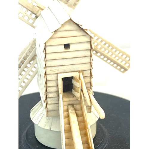 593 - Antique bone  windmill on an ebony base, probably prisoner of war piece, approximate height 14cm