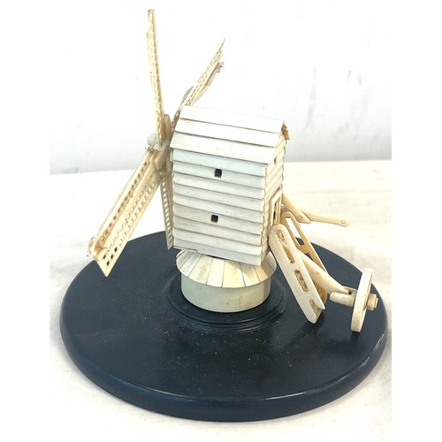 593 - Antique bone  windmill on an ebony base, probably prisoner of war piece, approximate height 14cm