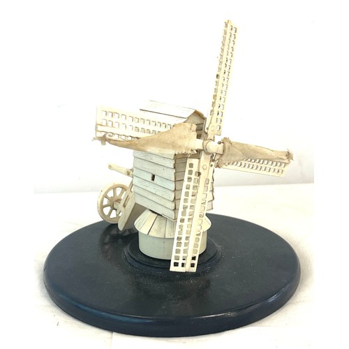 593 - Antique bone  windmill on an ebony base, probably prisoner of war piece, approximate height 14cm