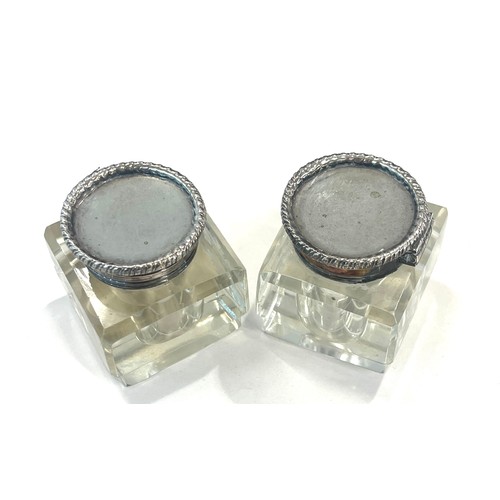 562 - Pair antique inkwells