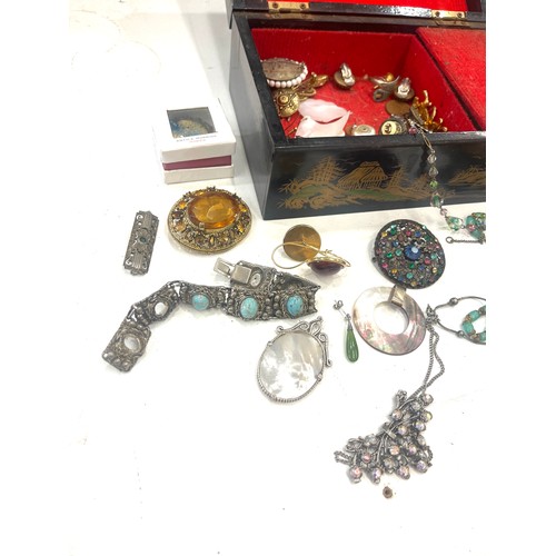 599 - Large selection of vintage and later costume jewellery includes silver pendant and badge