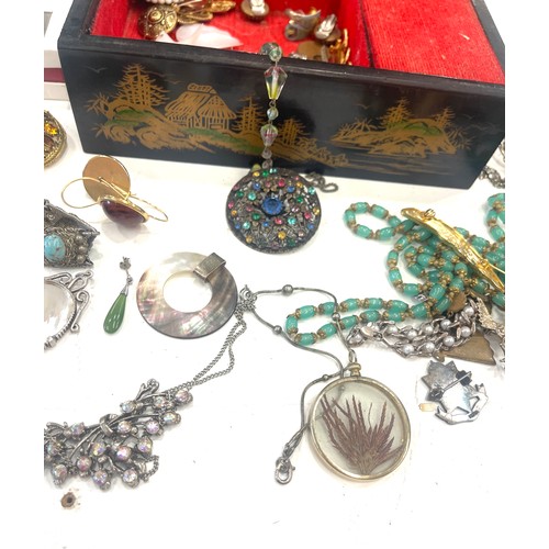 599 - Large selection of vintage and later costume jewellery includes silver pendant and badge