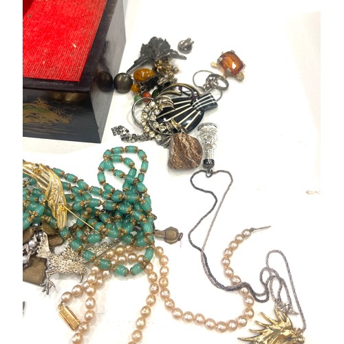 599 - Large selection of vintage and later costume jewellery includes silver pendant and badge