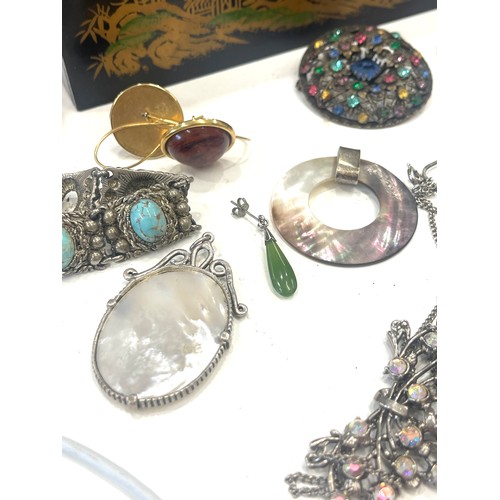 599 - Large selection of vintage and later costume jewellery includes silver pendant and badge