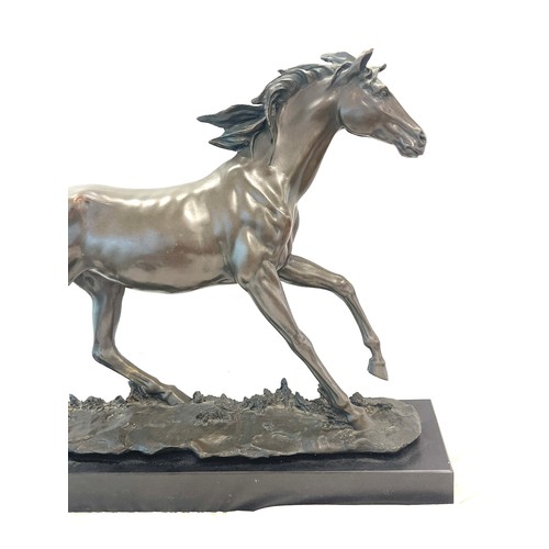 370 - Large Bronze sculpture of a elegant running Horse, mounted on a black polished solid Marble base, si... 