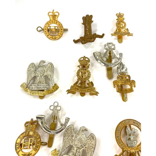 493 - 14 military cap badges