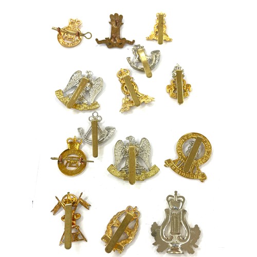 493 - 14 military cap badges