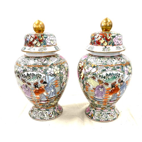 523 - Pair of lidded oriental vases with marks to base height approx 10.5