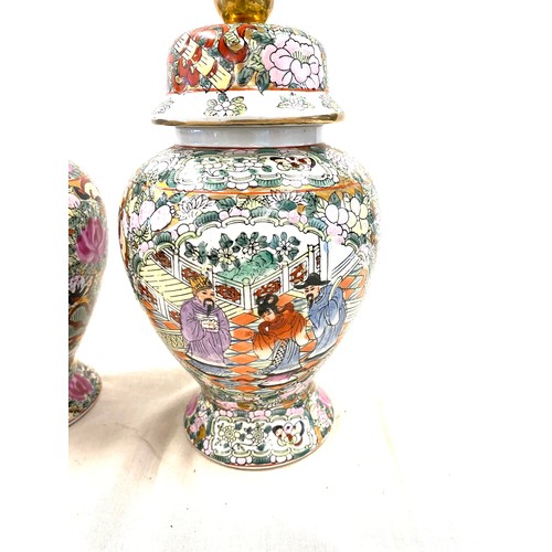 523 - Pair of lidded oriental vases with marks to base height approx 10.5