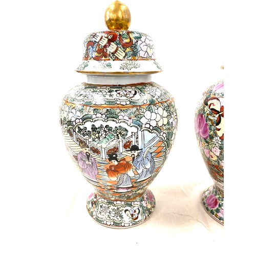 523 - Pair of lidded oriental vases with marks to base height approx 10.5