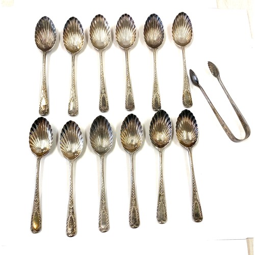 508 - 10 Silver hallmarked shell detail teaspoons, matching pair sugar tongs, overall weight 140g