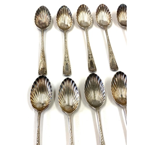 508 - 10 Silver hallmarked shell detail teaspoons, matching pair sugar tongs, overall weight 140g