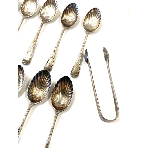 508 - 10 Silver hallmarked shell detail teaspoons, matching pair sugar tongs, overall weight 140g