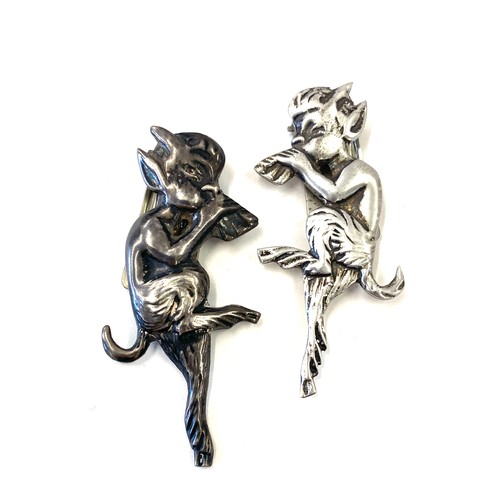 482 - Sterling silver pixie brooch, one white metal pixie brooch