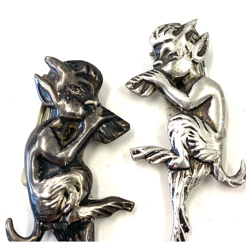 482 - Sterling silver pixie brooch, one white metal pixie brooch