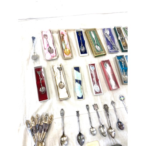 512 - Large selection of souvenir spoons includes 2 oriental silver spoons