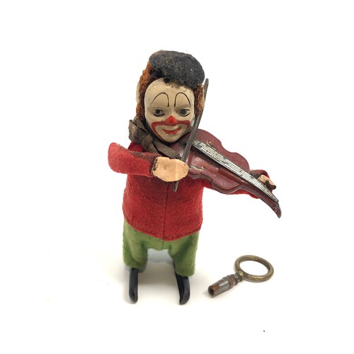 Vintage Schuco wind up clown playing violin the clown does wind uo and work key is not original