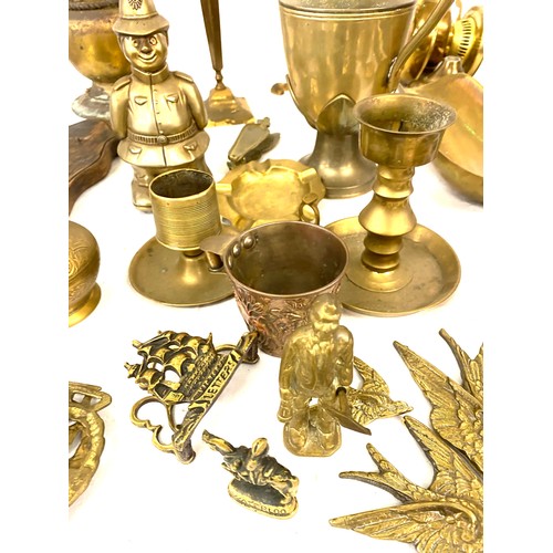 224 - Selection of assorted brass pieces to include candle sticks, trivets etc