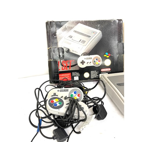 198 - Boxed Super Nintendo console, 2 control pads, charger, leads and game, untested