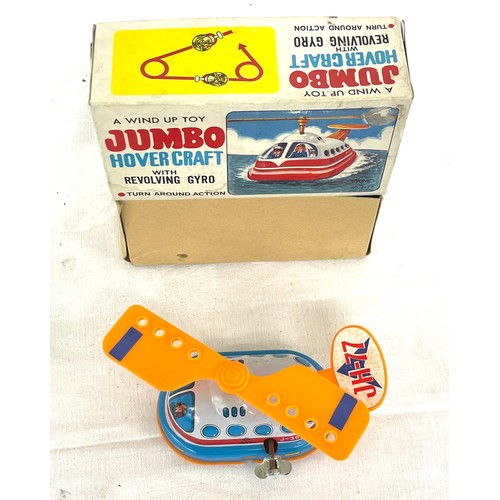 544 - Wind up tin hover craft j-3654 in original box