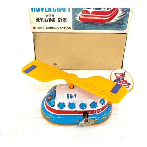 544 - Wind up tin hover craft j-3654 in original box