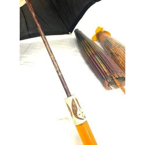 281 - Selection of vintage umbrellas/ parasols to include amber handled piece