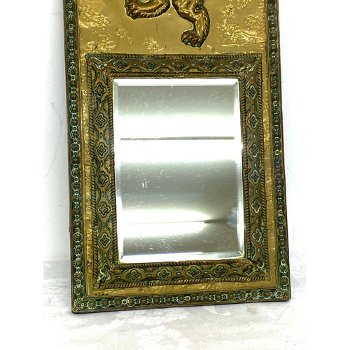 81 - Vintage brass framed mirror, lion detail, approximate measurements 21 x 10.5 inches