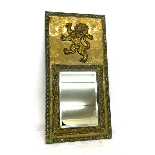 81 - Vintage brass framed mirror, lion detail, approximate measurements 21 x 10.5 inches