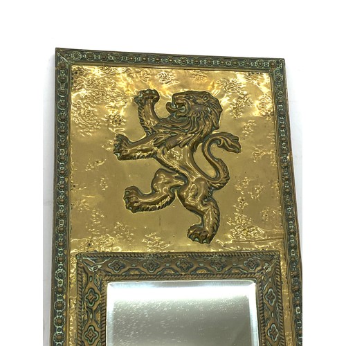 81 - Vintage brass framed mirror, lion detail, approximate measurements 21 x 10.5 inches