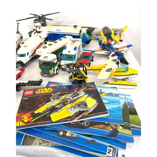 293 - Selection of built Lego City lego pieces, some booklets