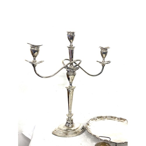 206 - Box of silver plated items to include decanter stand, candlestick