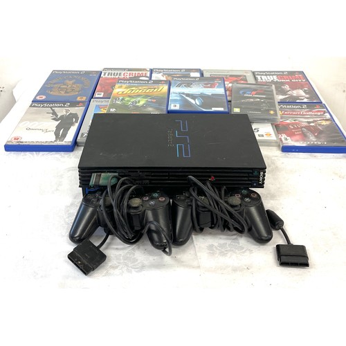 179 - PS2 console with selection of 13 games, 2 controllers, untested